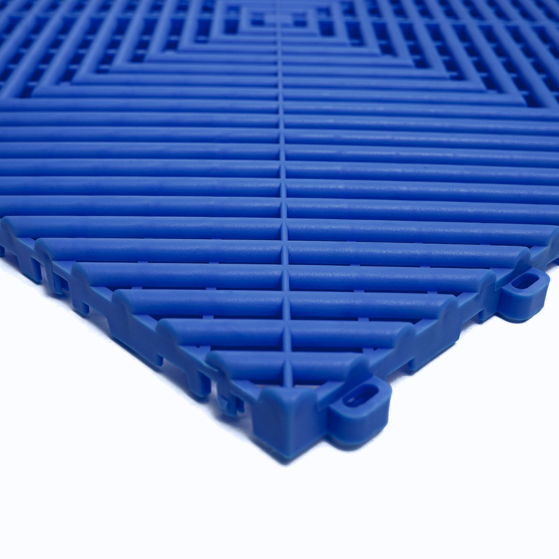 Blue plastic interlocking floor tile on a white background